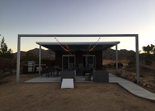 Minimalist style desert homestead house at sundown.