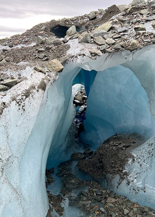 Tunnel of ice connected to a glacier