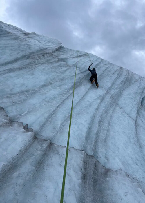 Mark Loftin ice climbing on a glacier in Alaska