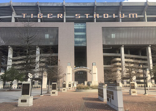 Main entrance to Tiger Stadium at Louisiana State University, walkway with memorials leading to gate.