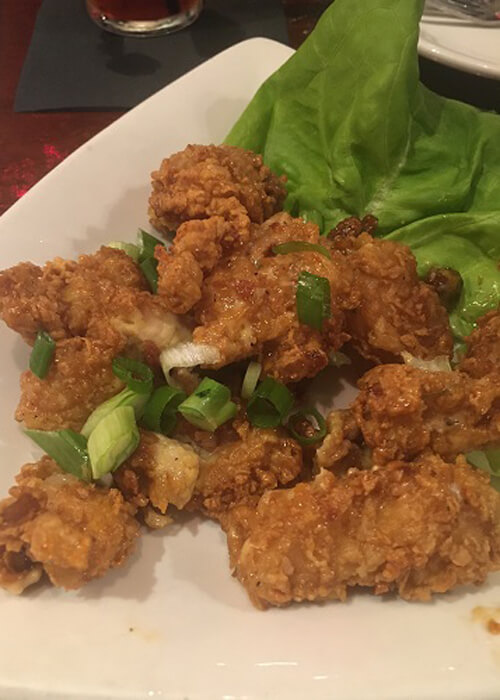 Fried alligator bites, resembling fried chicken tenders.