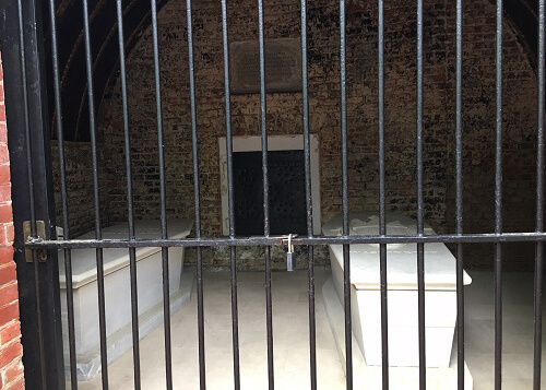 Looking through iron cage at George Washington's tomb.